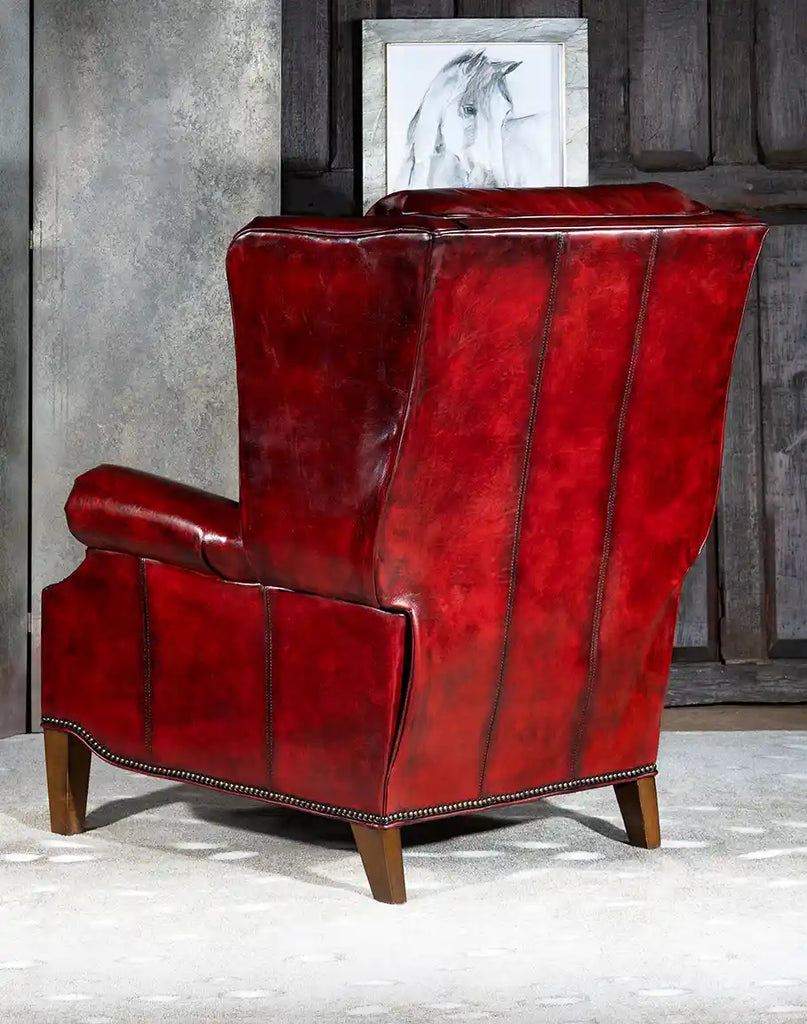 Back view of the Raspberry Leather Recliner featuring its smooth leather finish and elegant stitching.