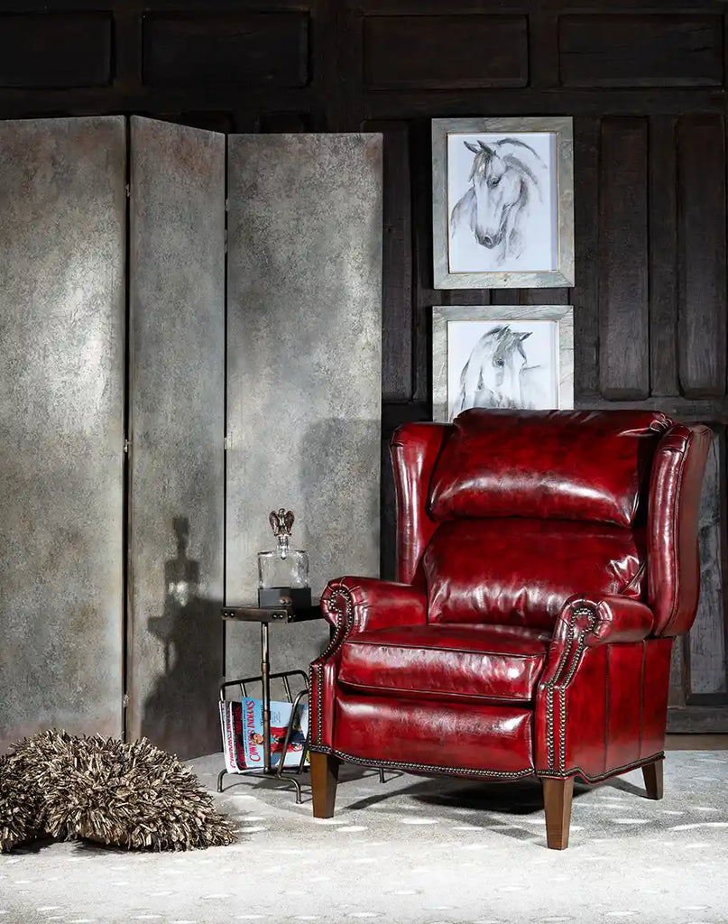 The Raspberry Leather Recliner placed in a stylish living room, demonstrating its presence as a statement piece.