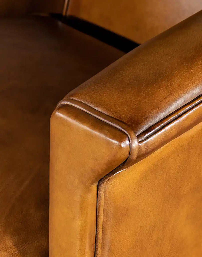 A detailed look at the rolled armrests of the Reno Club Chair, featuring extra padding for enhanced relaxation.