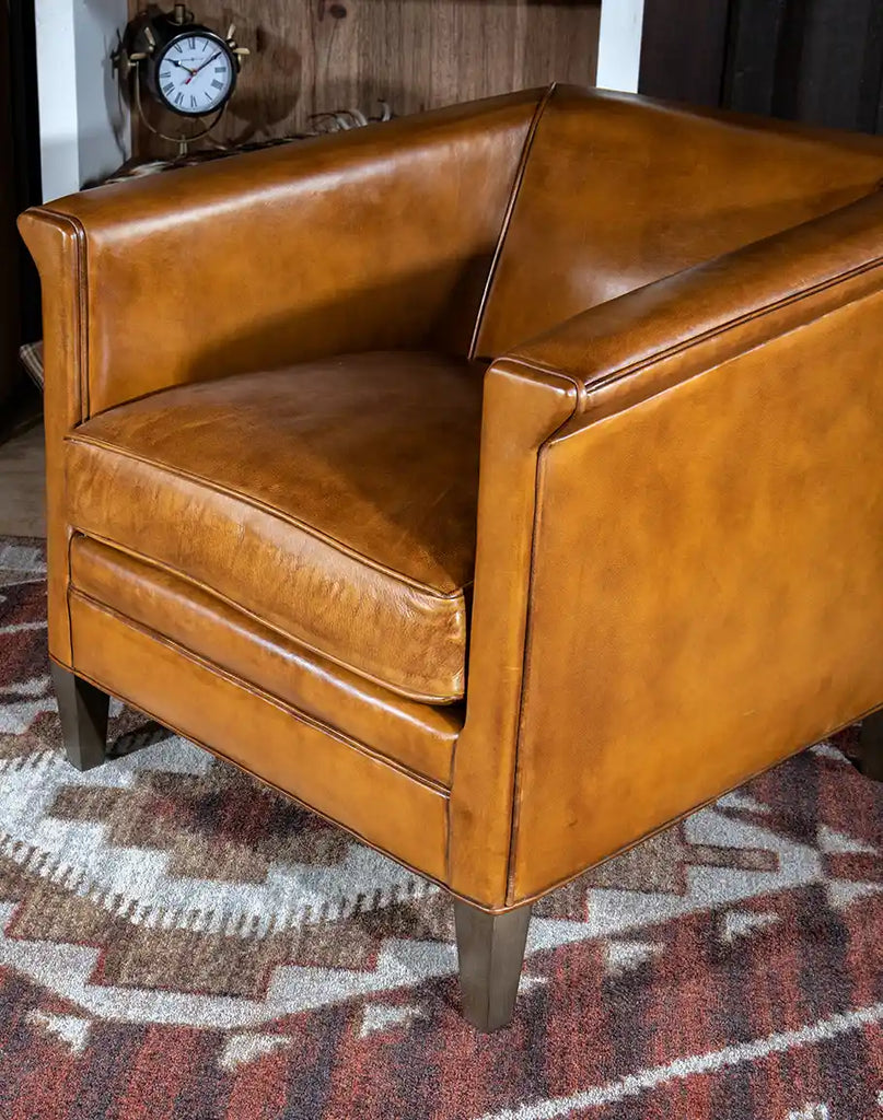 Top view of the Reno Club Chair, highlighting its rolled arms, plush cushioning, and elegant handcrafted details.
