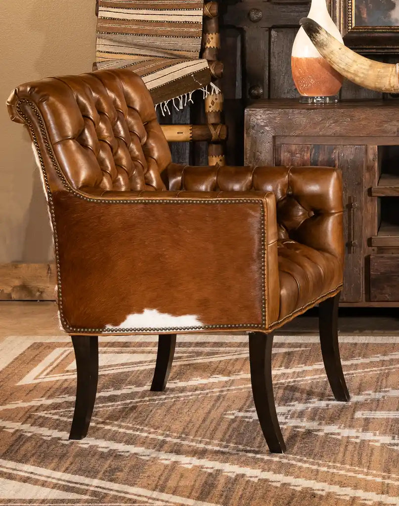 Side profile of the Revo Tufted Leather Chair highlighting its elegant handcrafted construction and refined silhouette.