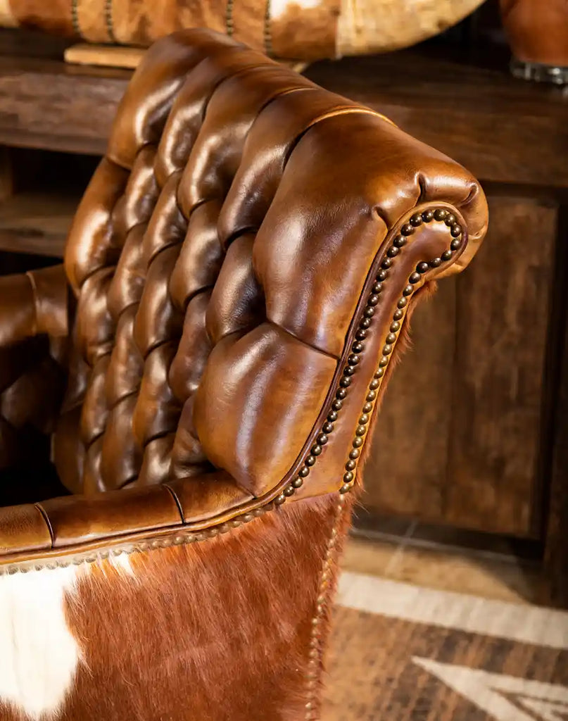 Close-up of the Revo Tufted Leather Chair's elegant backrest showcasing its timeless tufted design and premium leather craftsmanship.