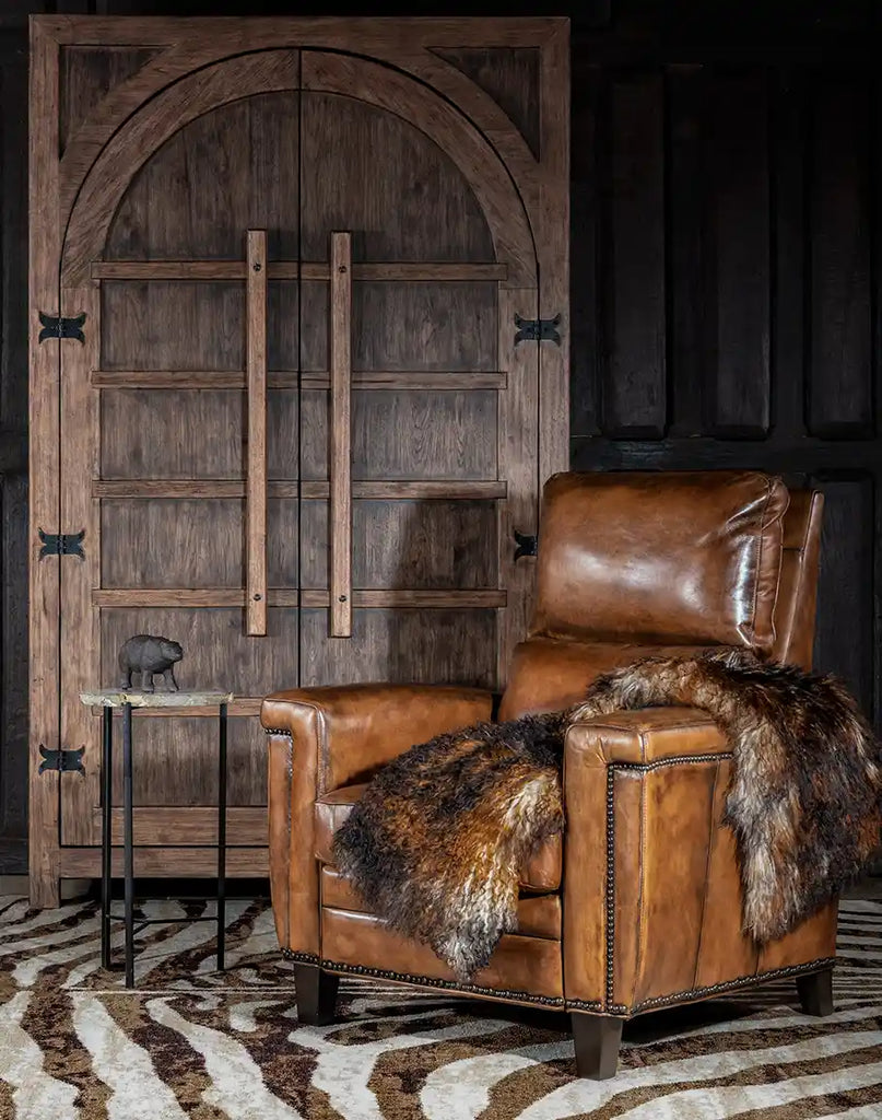 Revolt Bourbon Leather Recliner styled in a rustic living room, blending luxury and comfort seamlessly.