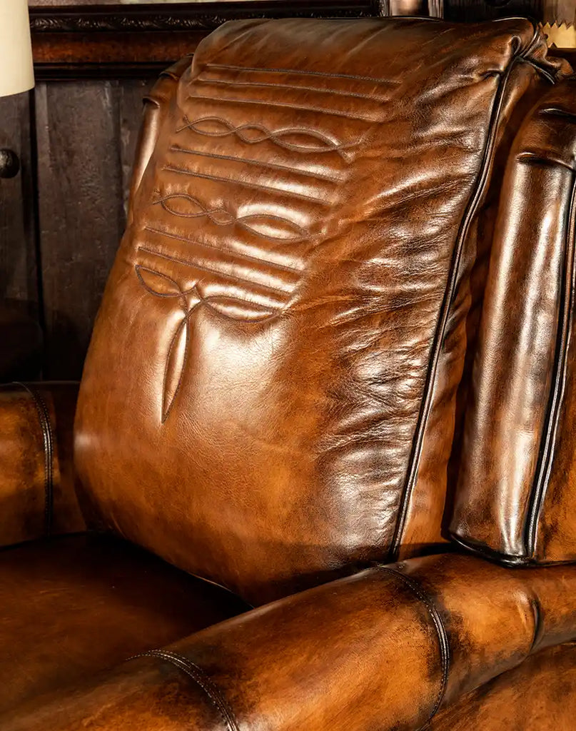 Detailed close-up of the premium, hand-burnished leather texture on the Richard King Recliner.