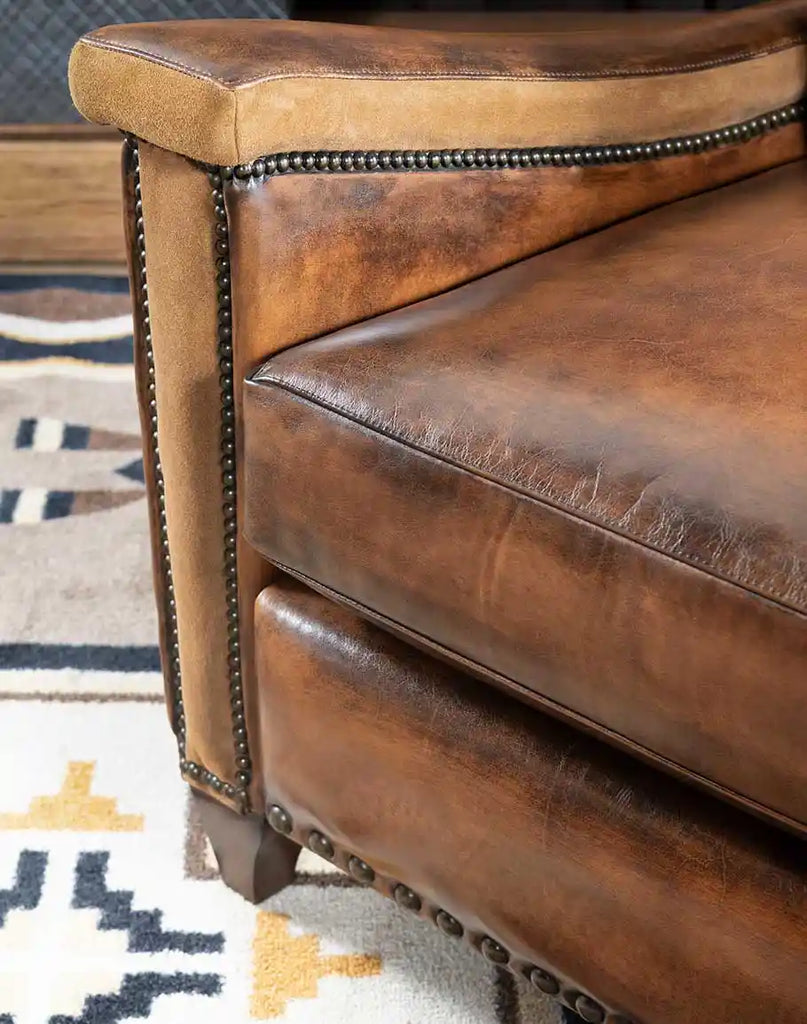 The sueded right arm panel of the Vlad Brown Leather Recliner, adding texture and contrast to the design.