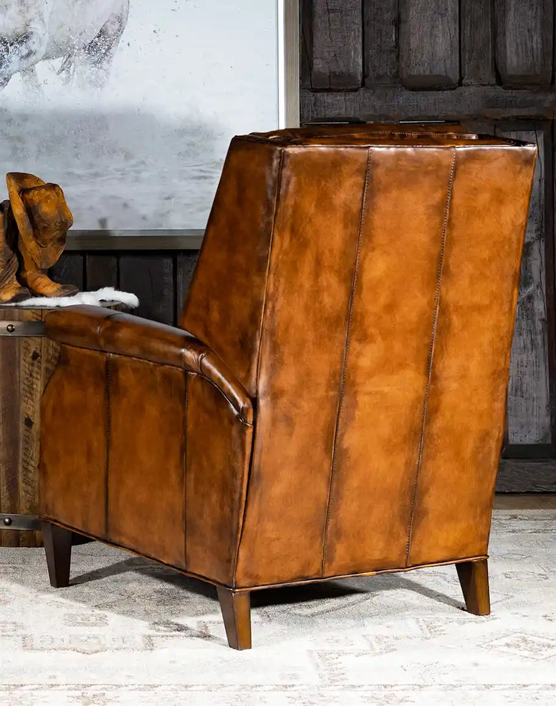 A rear view of the recliner, displaying the rich hand-tanned leather and meticulous craftsmanship.