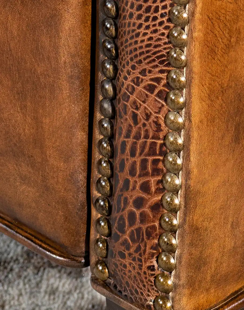 Close-up of the embossed croc leather armrests, adding a bold and sophisticated design element.