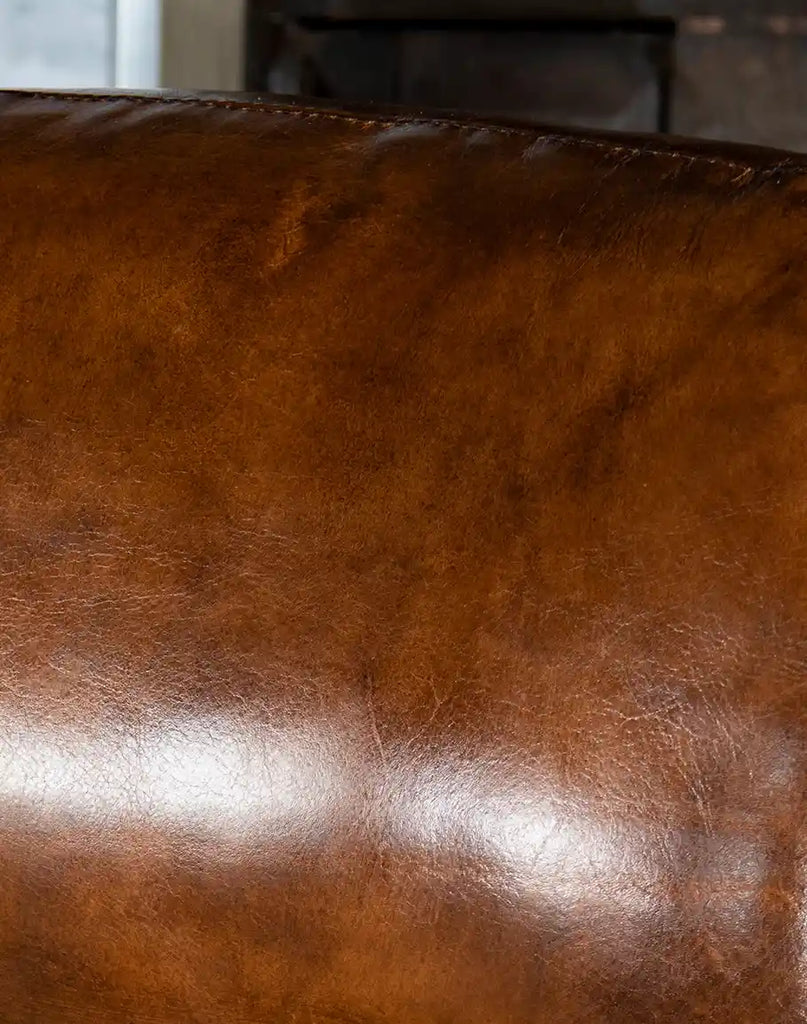 A macro shot of the hand-tanned leather, showcasing its rich texture and expert craftsmanship.