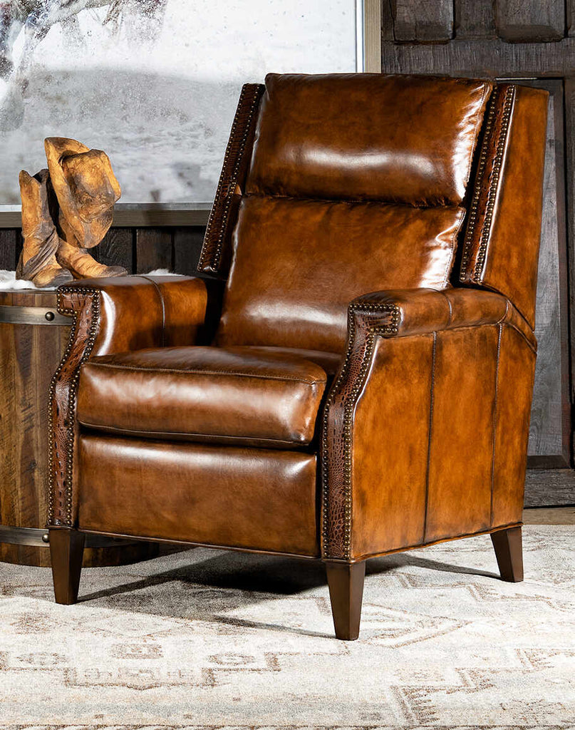 Riley Dundee Recliner showcasing its artisan leather upholstery and classic bustle-back design.