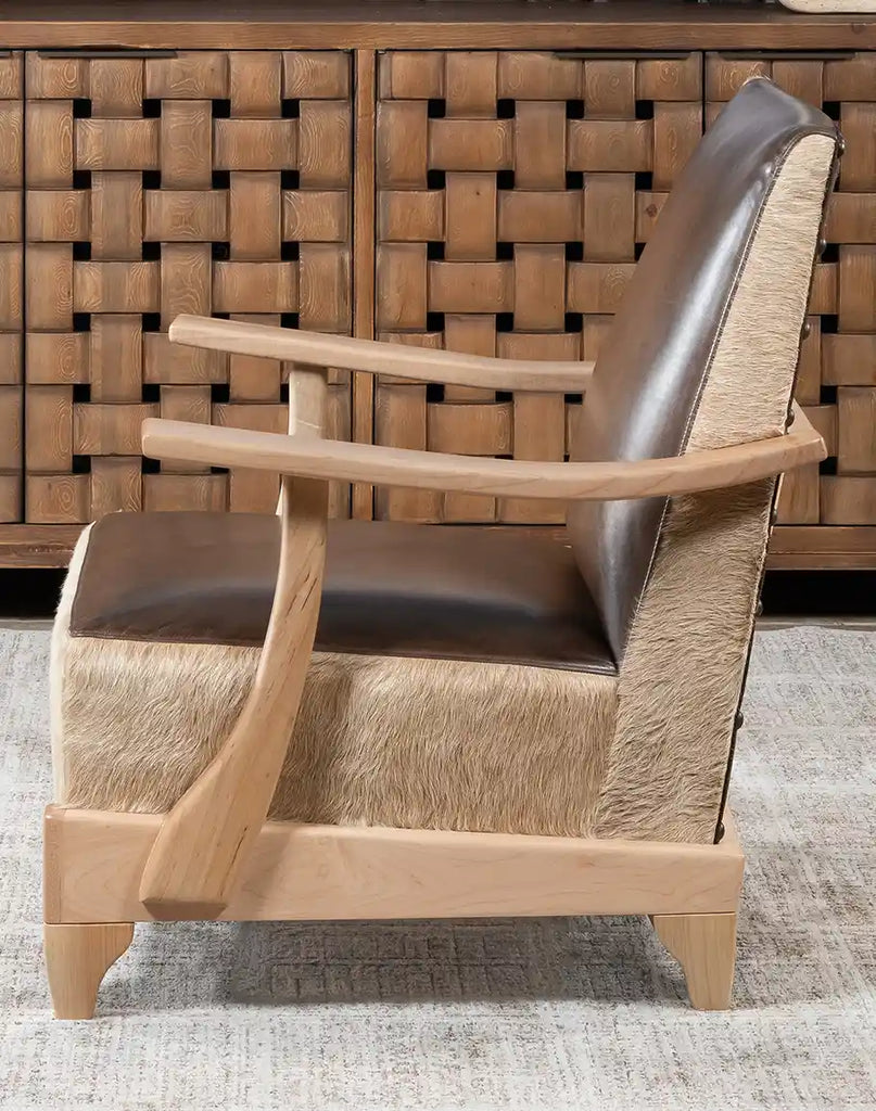 Side angle of the Robin Leather Chair highlighting its refined armrest and ergonomic design.