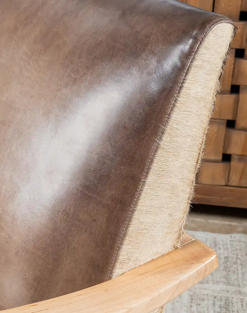 Macro shot of the Robin Leather Chair's fine leather grain.