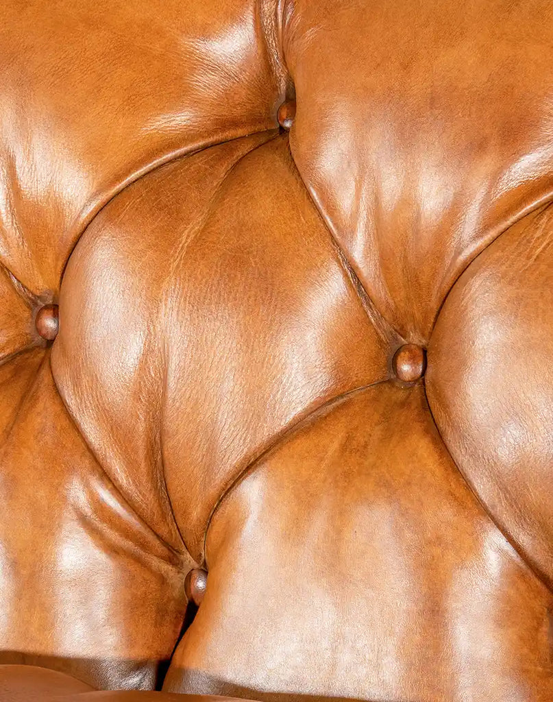 Detailed close-up of the deep button tufting on the Rochfort Chesterfield Sofa’s backrest.