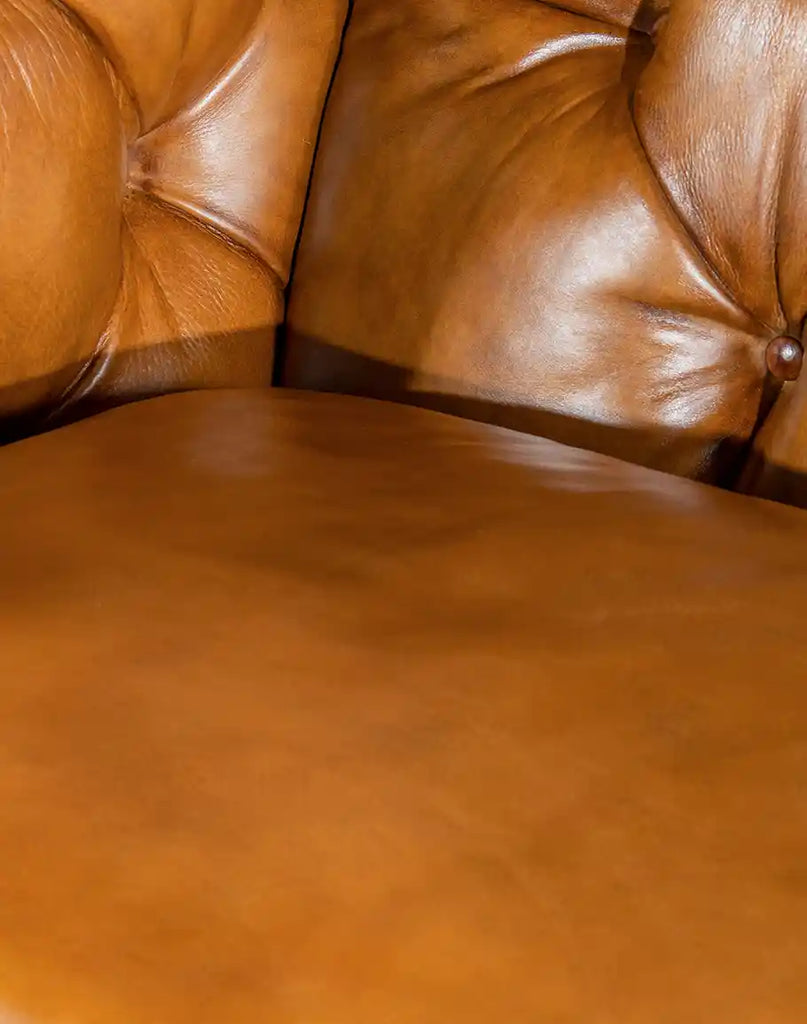 High-quality full-grain leather with a hand-burnished finish on the Rochfort Chesterfield Sofa.