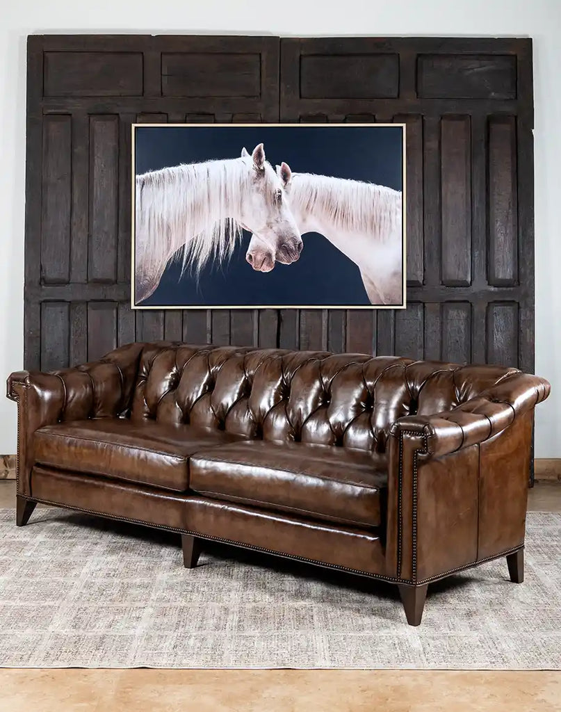 Angled view of the Rockwood Smoked Chesterfield Sofa, highlighting its detailed button tufting and smoky bronze leather.