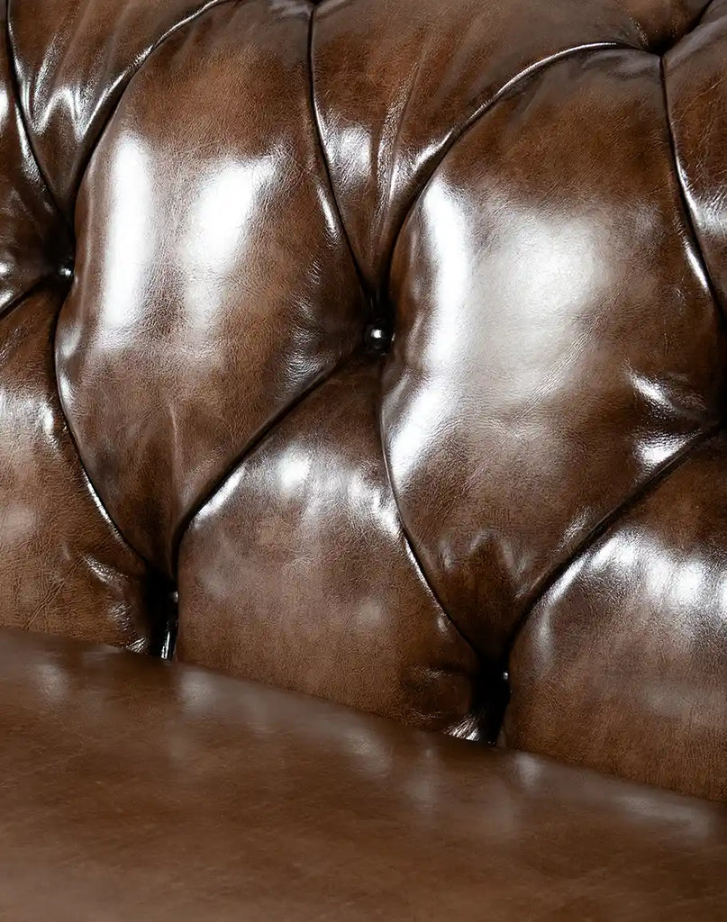 Close-up of the intricate button tufting on the inner back and arms of the Rockwood Smoked Chesterfield Sofa.