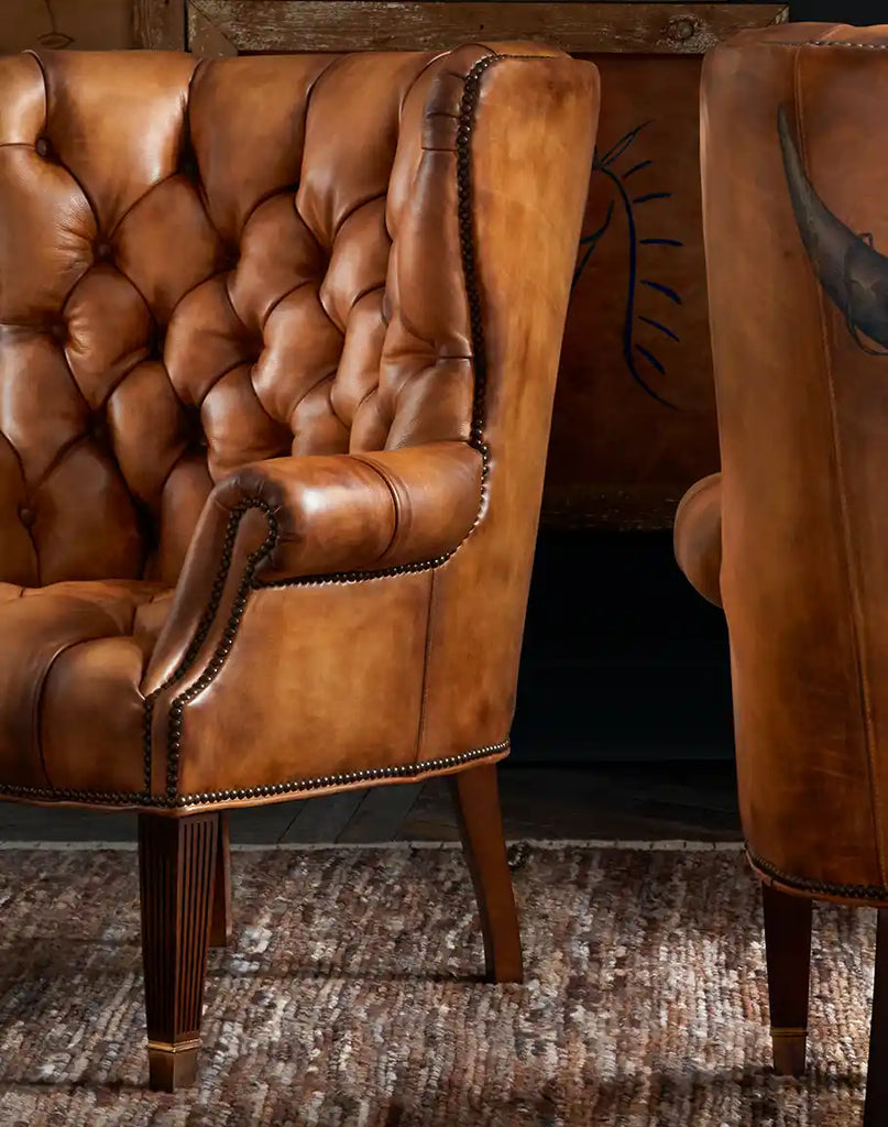 Angled view of the Rose Horns Tufted Leather Chair, highlighting its hand-burnished full-grain leather and exquisite craftsmanship.