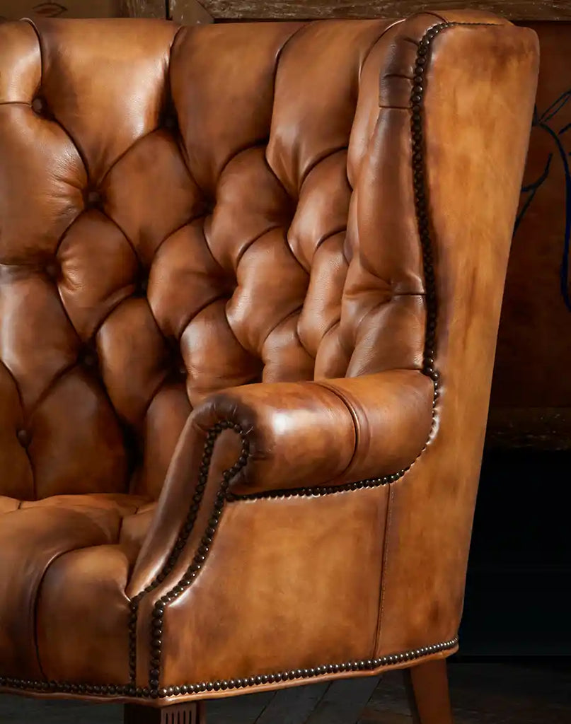 Close-up of the deep button tufting on the Rose Horns Tufted Leather Chair, demonstrating exceptional attention to detail.