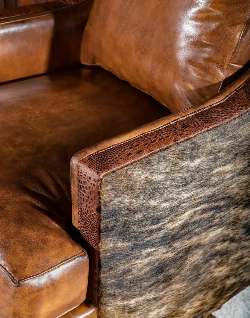 Detailed shot of the brindle cowhide accents, adding a unique and rustic touch to the chair’s design.