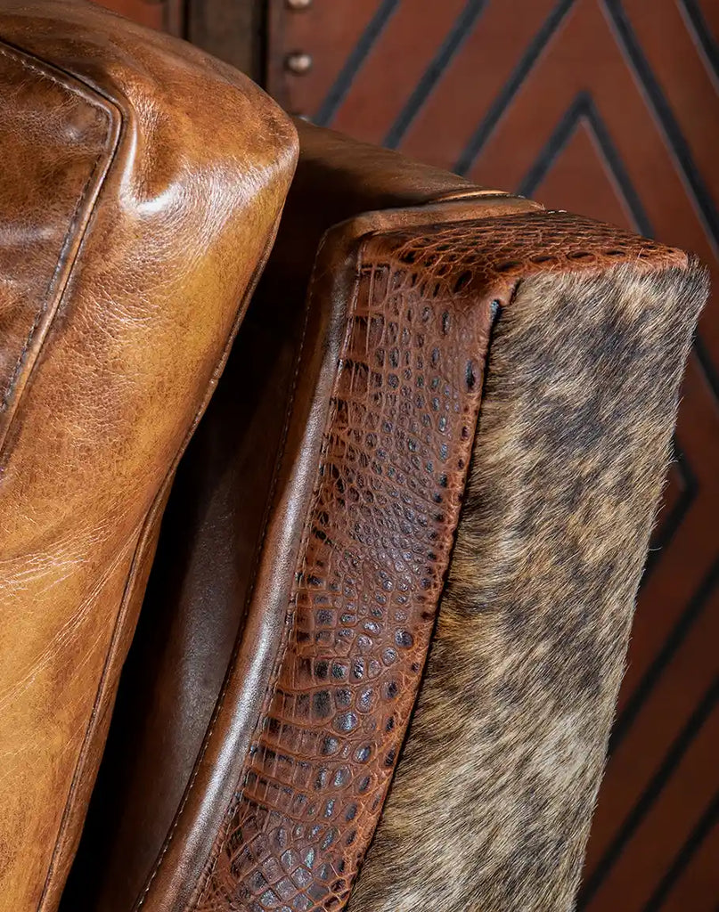 A close-up of the stamped croc leather arm rails, showcasing their textured, high-end appeal.