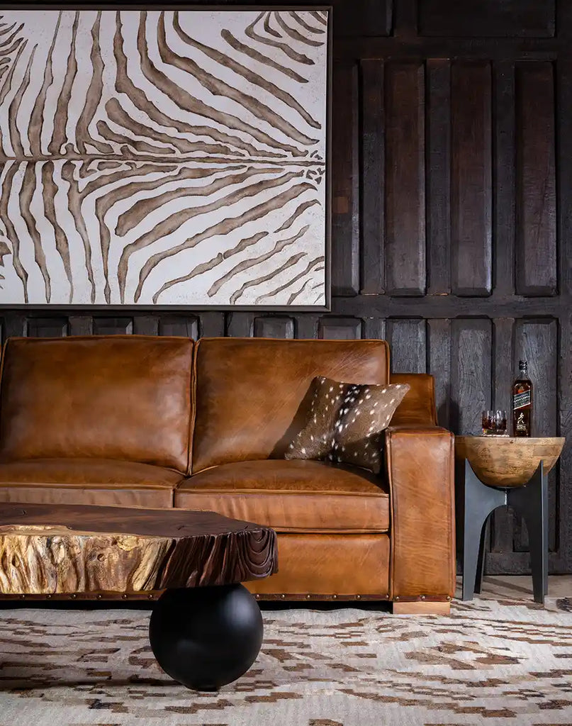 Ruby Cognac Leather Sofa styled in a cozy living room with neutral tones, emphasizing its refined elegance.