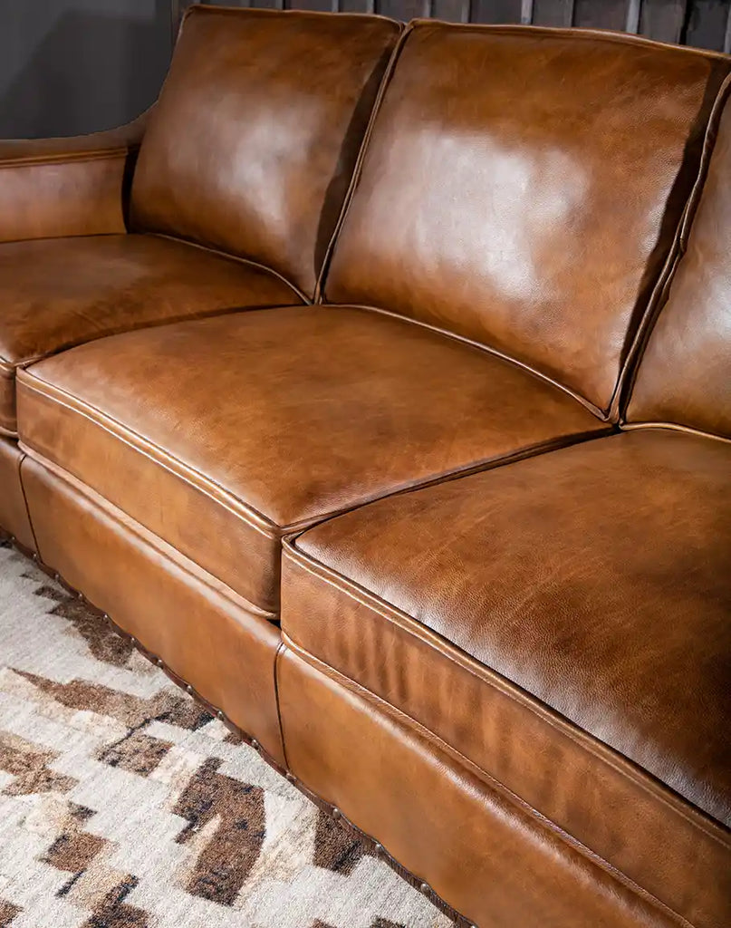 Close-up of the padded seat on the Ruby Cognac Leather Sofa, designed for ultimate comfort and softness.