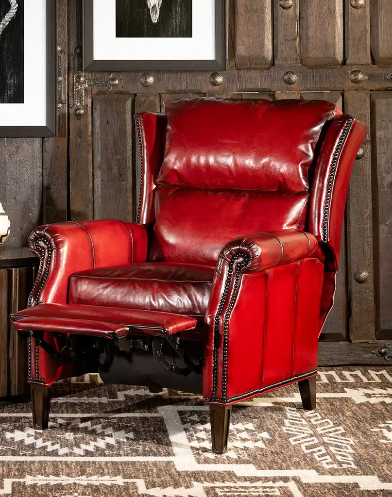 The Ruby Red Leather Recliner fully extended, showcasing its smooth reclining mechanism and high-density cushioning for ultimate comfort.