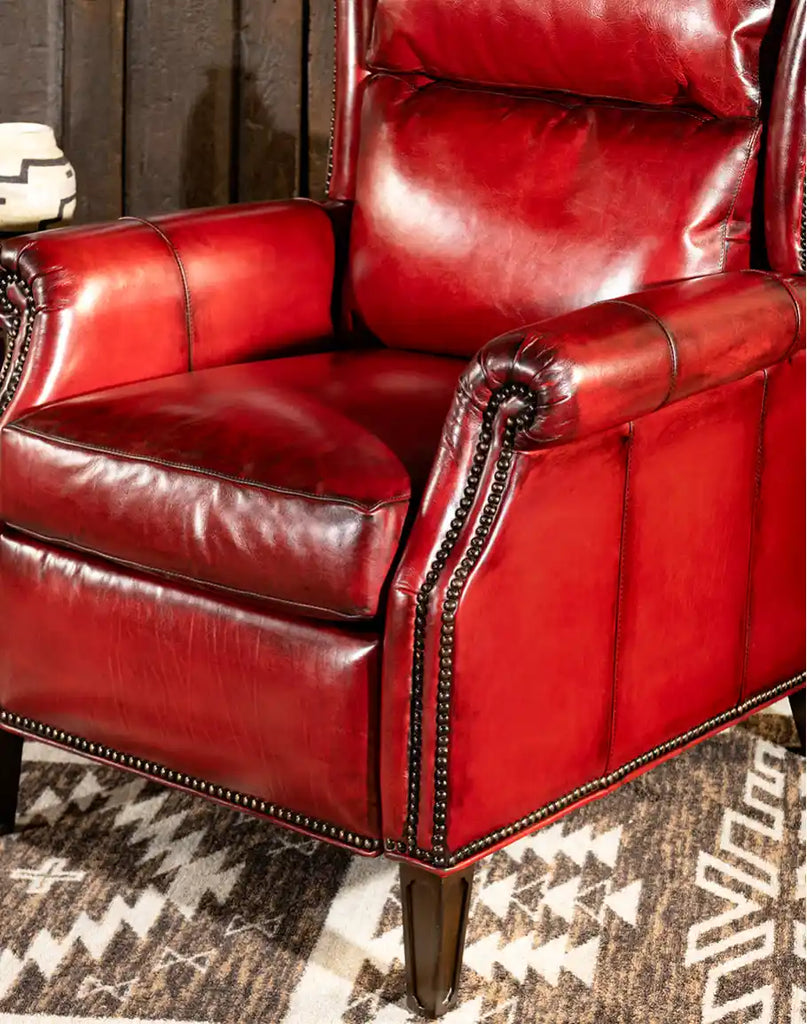 Side view of the Ruby Red Leather Recliner, highlighting its sleek silhouette, plush cushioning, and high-quality hardwood frame.