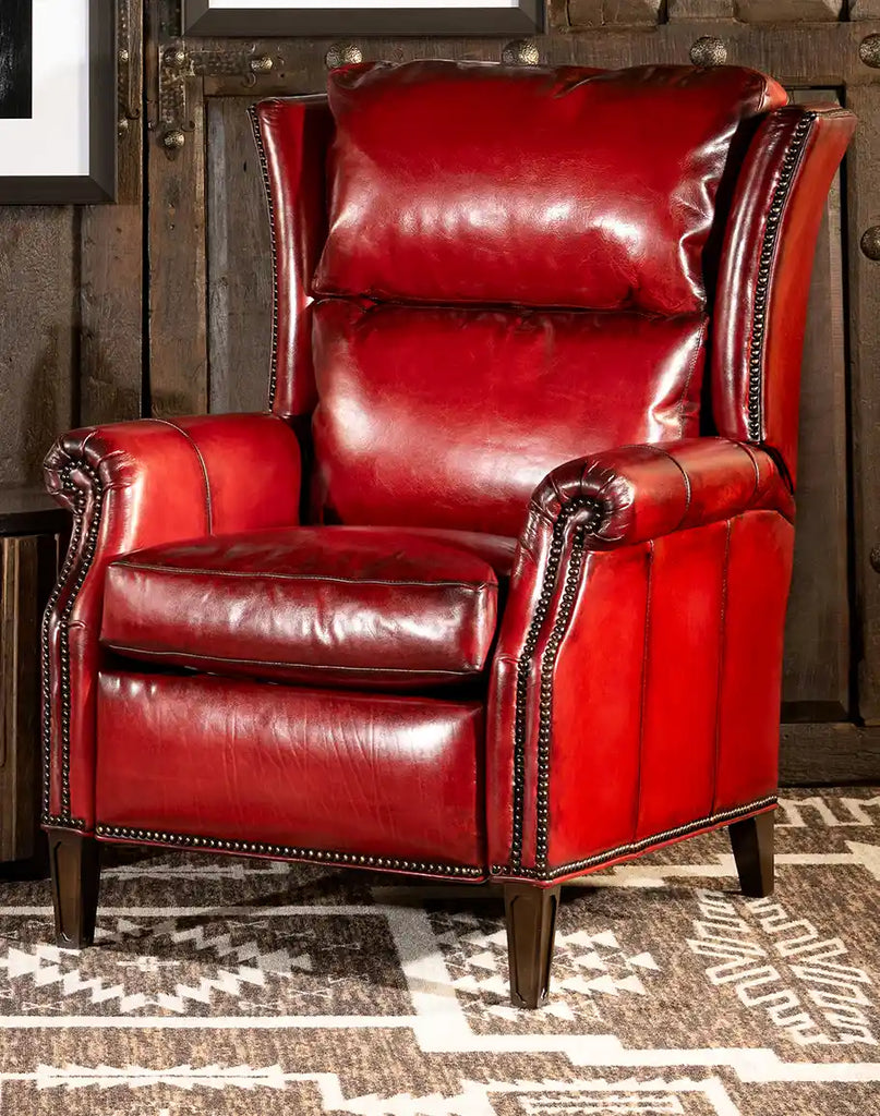 Ruby Red Leather Recliner with top-grain Italian leather, bronze nail head accents, and hand-burnished details, showcasing its elegant design.