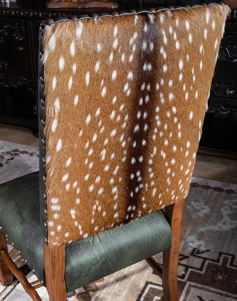 The outer back of the Forest Green Saguaro Leather Dining Chair featuring authentic axis deer hair, adding a rustic and unique touch.