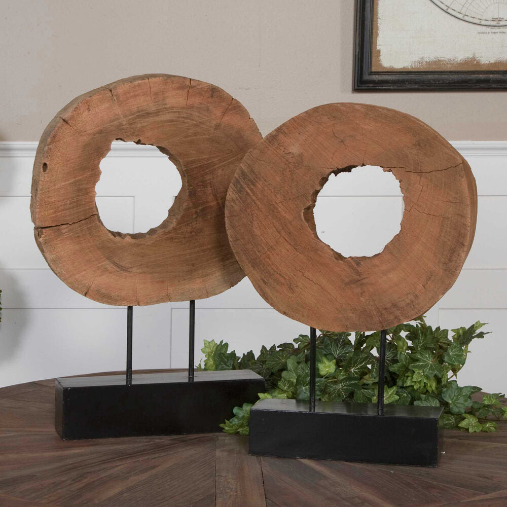 Handcrafted mango wood logs with natural finish, displayed on sleek matte black metal bases.