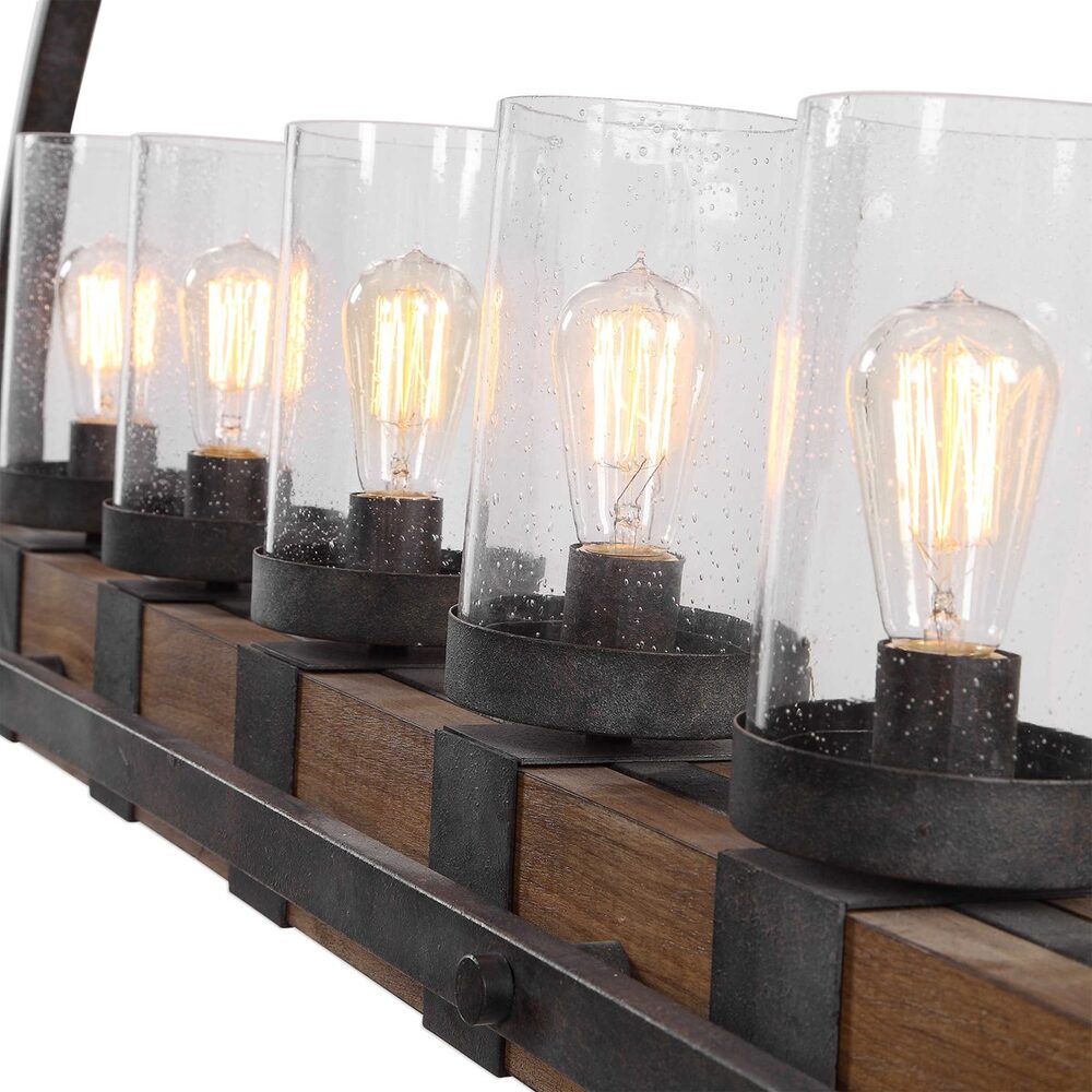 Dining room pendant light with rustic design, black accents, and clear glass covers for five lights.