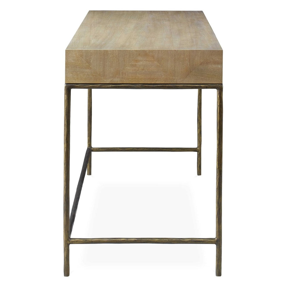 Rustic-modern primavera wood desk with durable gold cast iron frame and minimalist design.