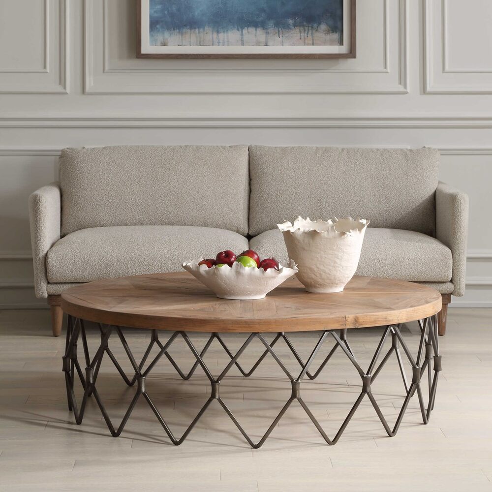 Coffee table with a solid reclaimed wood surface in a parquet pattern, supported by a sturdy aged iron chain link frame.