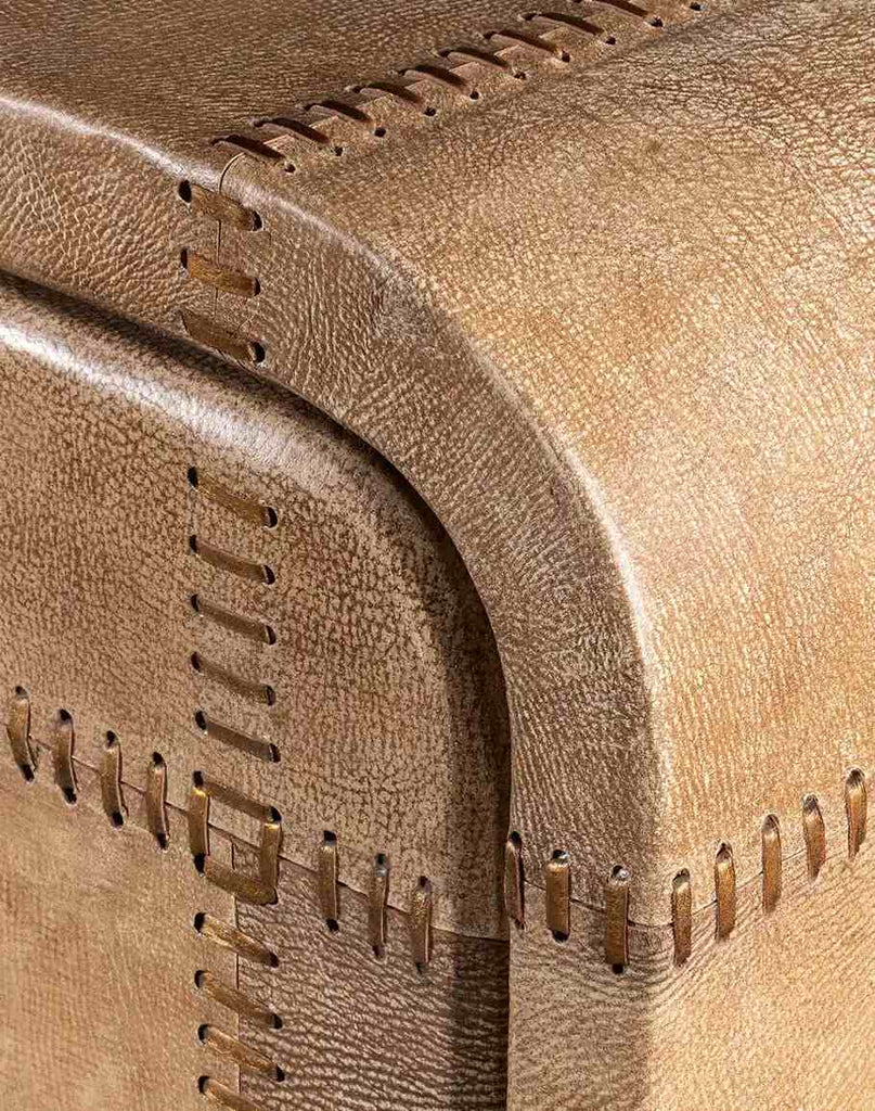 A close-up of the corner of the Sahara Sand Buffet, showcasing the intricate leather stitching and durable construction.