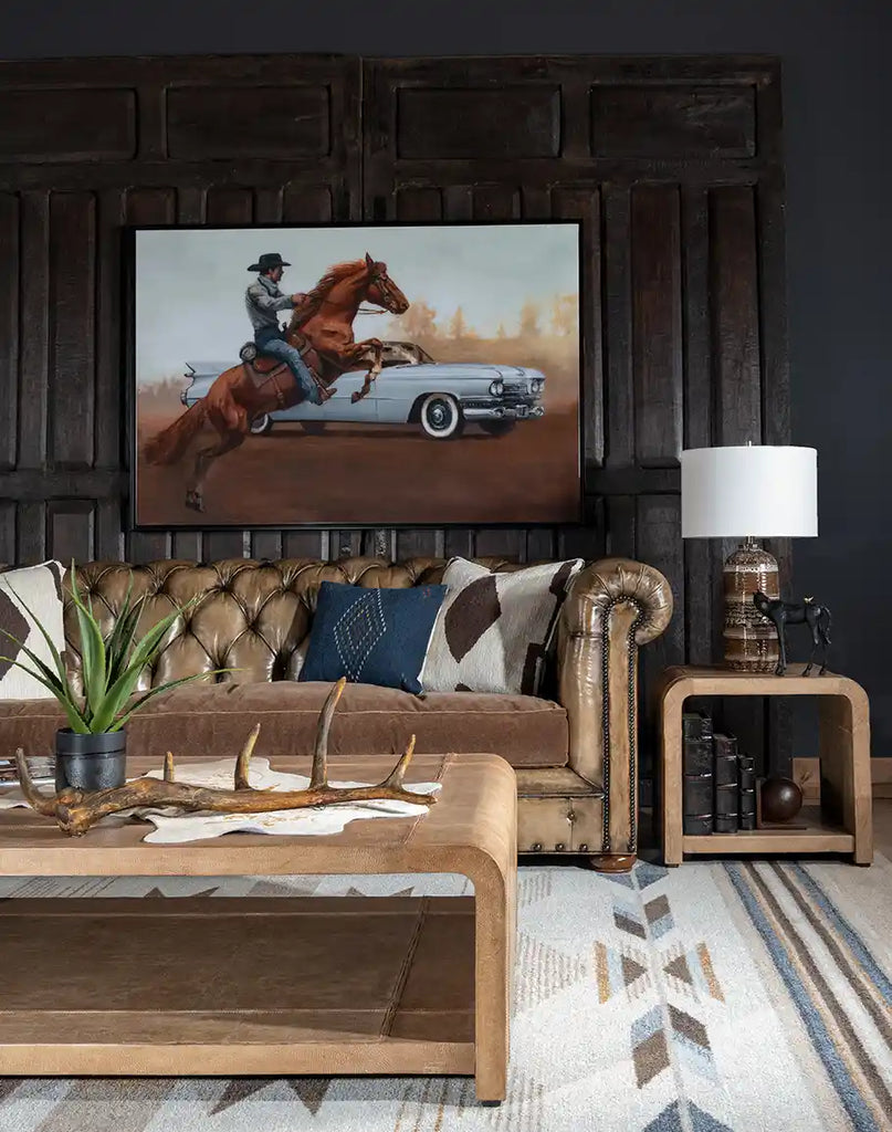 A close-up of the corner of the Sahara Sand Leather Coffee Table, showcasing its smooth waterfall edge and meticulous leatherwork.