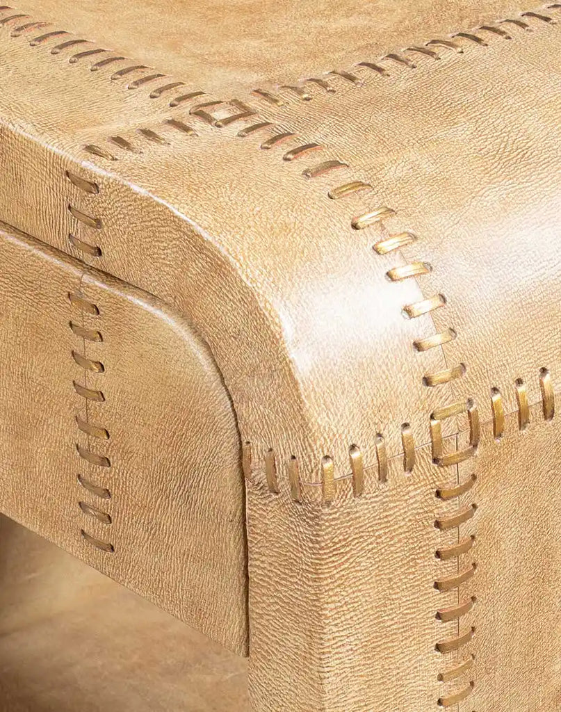 A detailed view of the Sahara Sand Leather Nightstand’s handwoven leather laces, creating a unique and intricate stitch pattern for added sophistication.