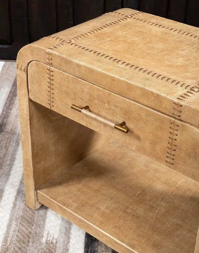 A close-up of the top surface of the Sahara Sand Leather Nightstand, displaying its smooth leather finish and luxurious craftsmanship.