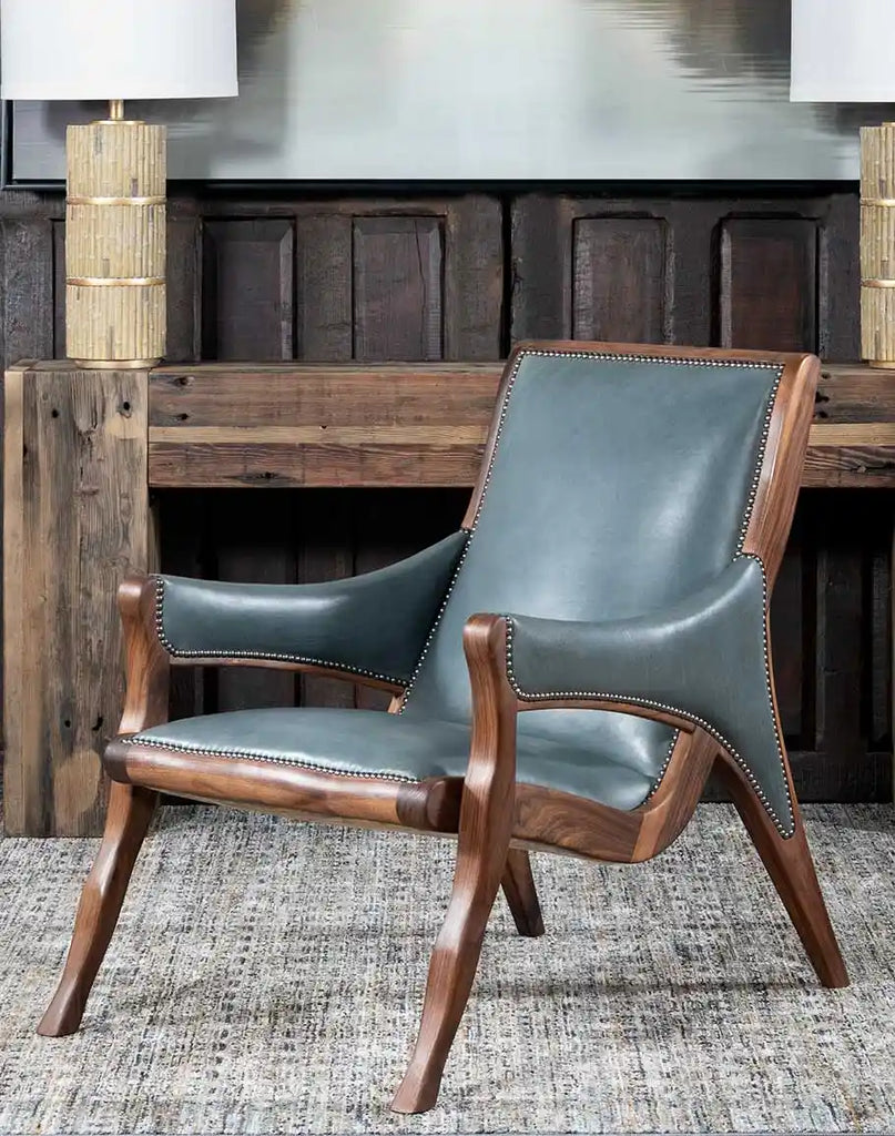 Sailor Grey Leather Chair showcasing its grey-blue full-grain leather upholstery and refined silhouette.