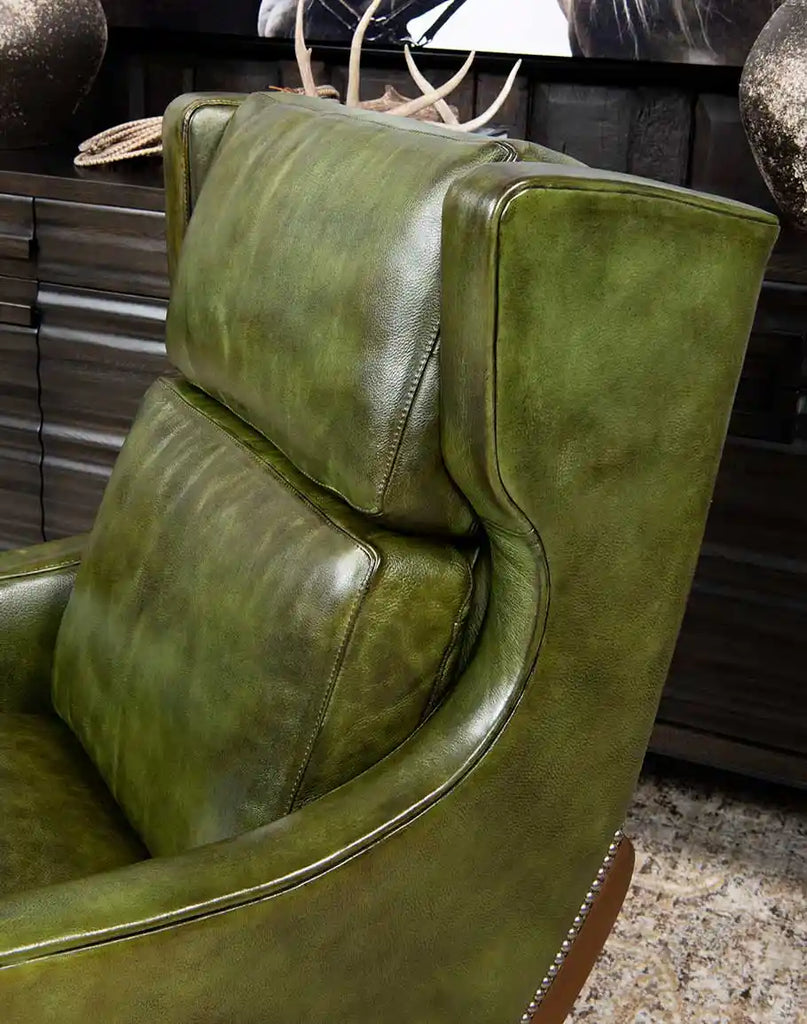 A close-up of the Seabrook Moss Leather Chair’s smooth backrest, emphasizing its sleek design and premium leather upholstery.