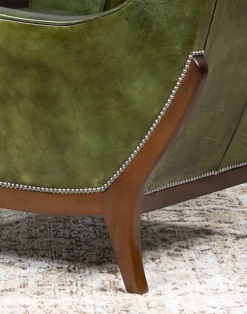 A close-up of the hand-applied nailhead trim on the Seabrook Moss Leather Chair, adding a touch of sophistication and craftsmanship.