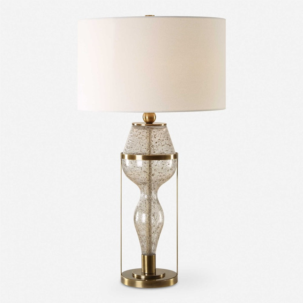 Elegant table lamp with a distinctive hourglass glass design, complemented by a crisp white drum shade.