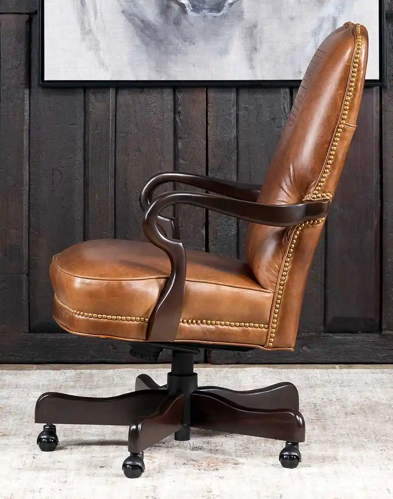 Side profile of Baileys Boot Stitch Office Chair, highlighting its curved armrests and brass nailhead trim.