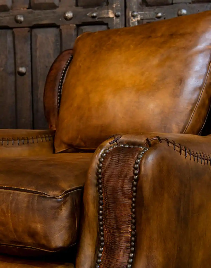 Side profile of the Farmhouse Ranch Chair, showing its sturdy hardwood frame, curved arms, and Western-inspired silhouette.