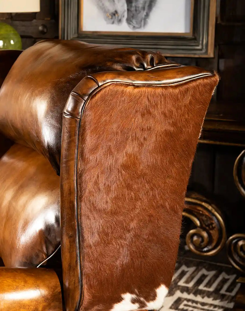 Side profile view of the Scottie Leather Recliner, showing its sturdy frame and luxurious leather finish.