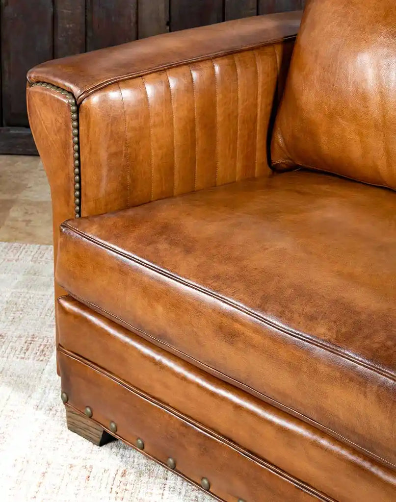 Side view focusing on the gently sloped armrest, offering both style and comfort in the Herdsman Leather Sofa.