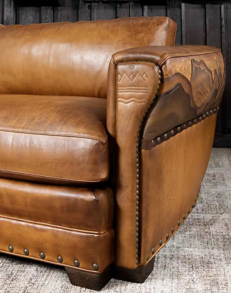 Close-up of the sofa's sturdy wooden legs, emphasizing the quality of American craftsmanship.