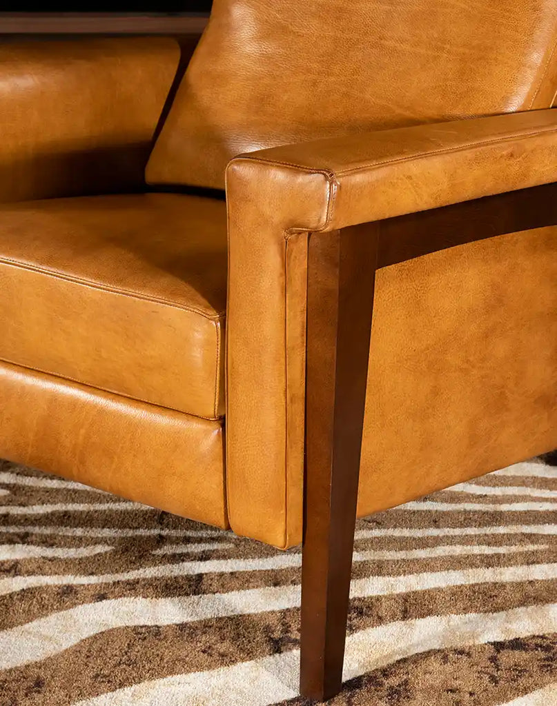 A close-up of the recliner’s sturdy wooden legs, ensuring durability and stability while complementing the chair’s rustic charm.