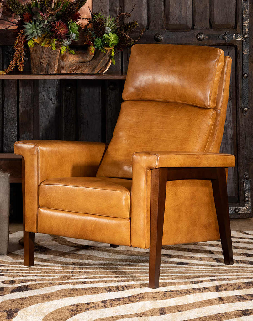 The Slater Saddleback Recliner showcasing its hand-burnished leather and plush cushioning.