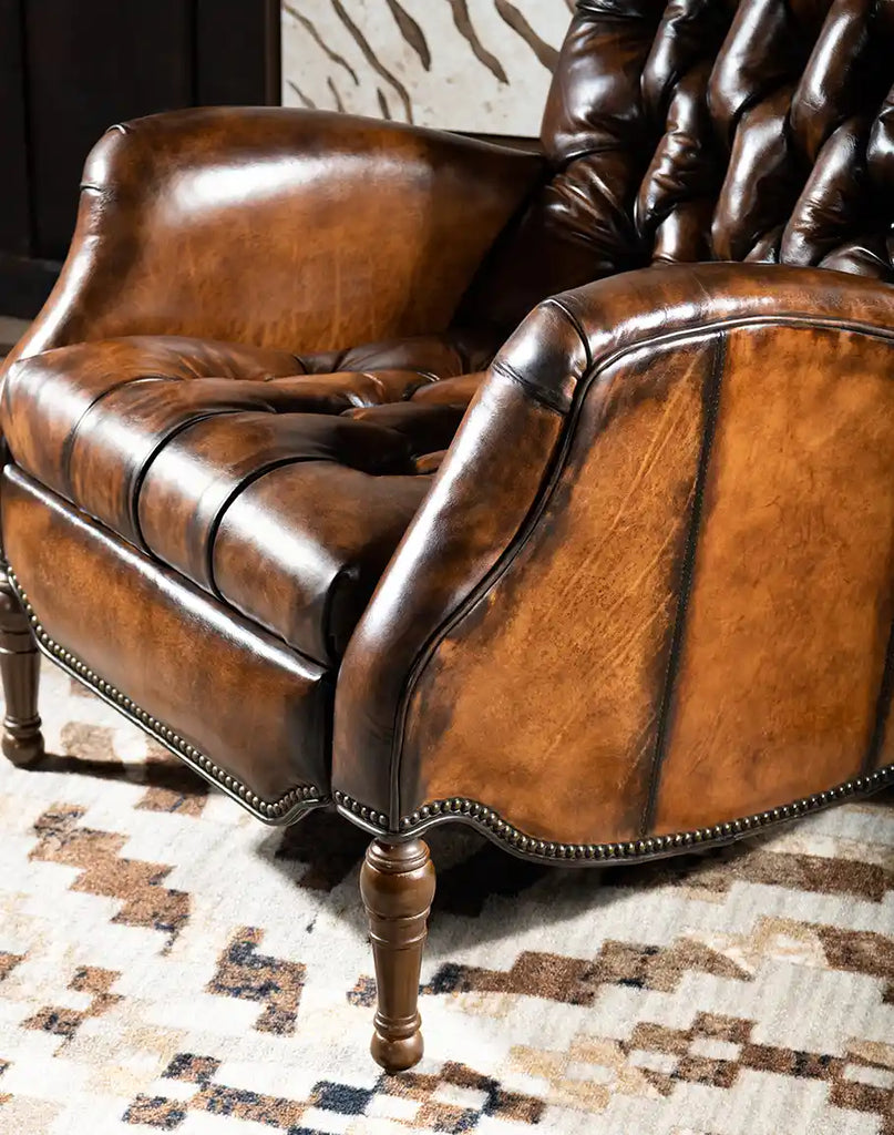 Close-up of the armrest on the Sleepers Haven Mocha Recliner, showcasing its smooth leather finish and elegant stitching.