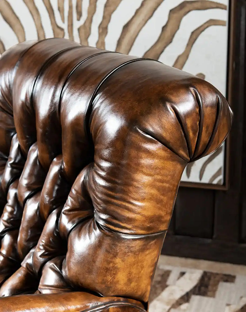 Detailed view of the deep button tufting on the Sleepers Haven Mocha Recliner, adding a touch of sophistication.